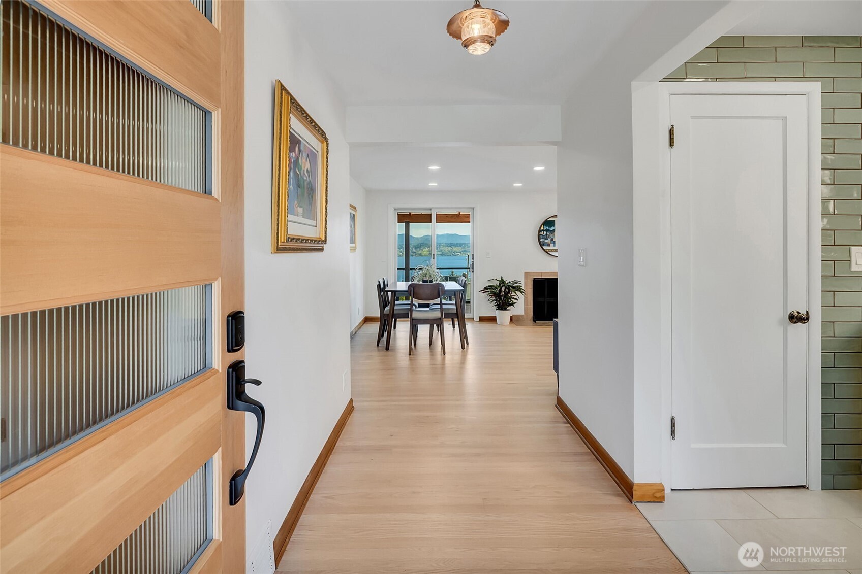 9804 63rd Avenue South Seattle, WA 98118 - Photo 4 of 40 a view of a living room and dining room