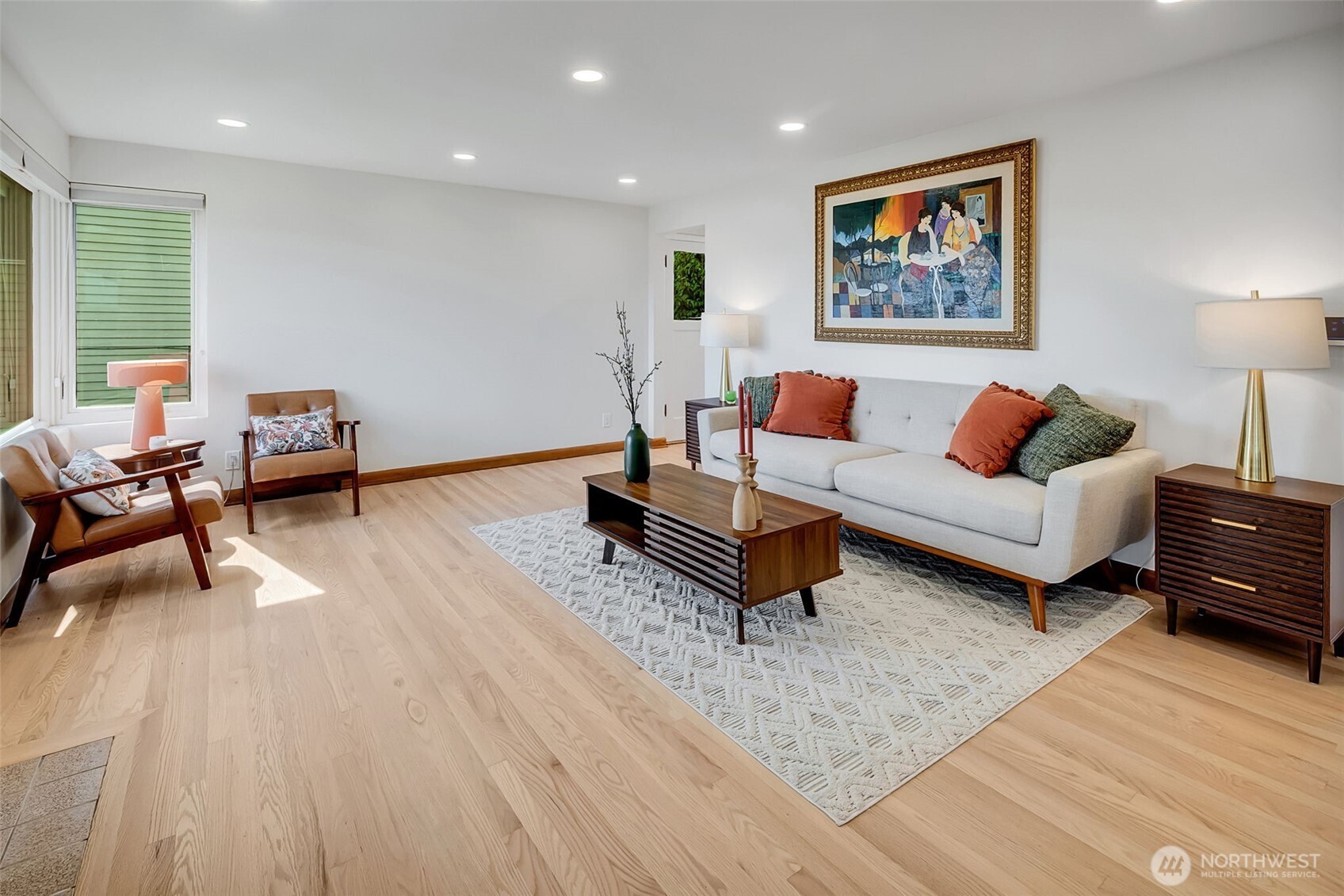 9804 63rd Avenue South Seattle, WA 98118 - Photo 6 of 40 a living room with furniture and a wooden floor