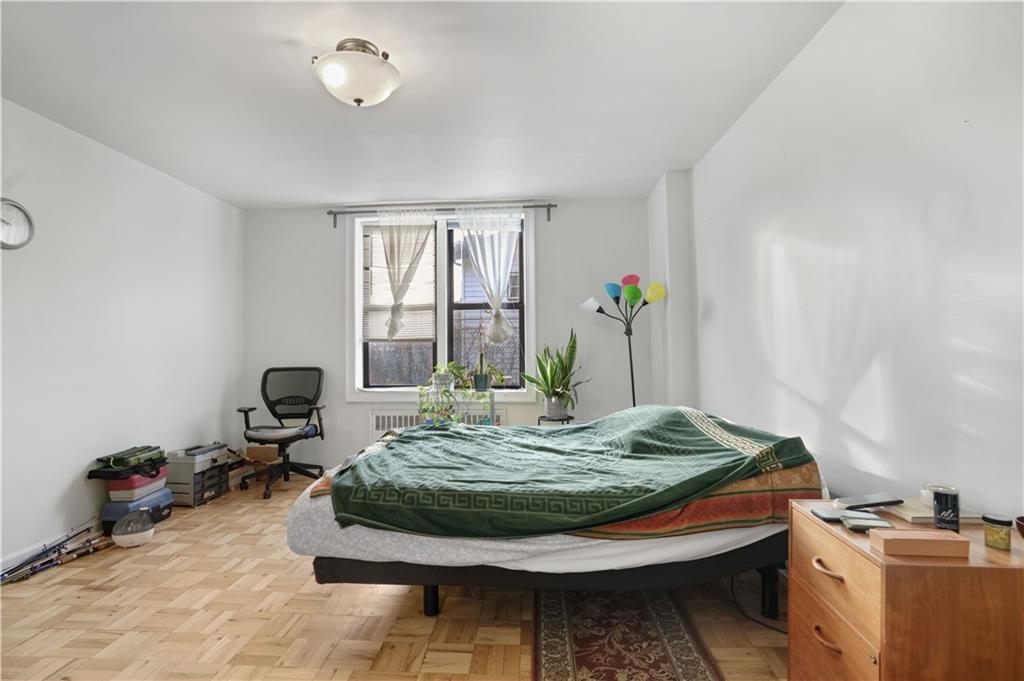 1075 Sheepshead Bay Road, Unit 2S Brooklyn, NY 11229 - Photo 14 of 30 a room with furniture and window