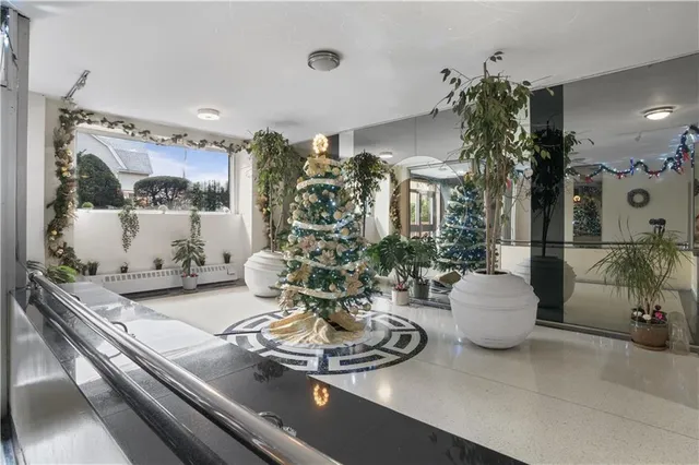 a view of a dining room with furniture and chandelier