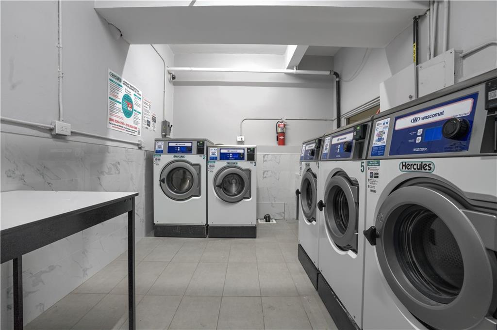 1075 Sheepshead Bay Road, Unit 2S Brooklyn, NY 11229 - Photo 23 of 30 a utility room with dryer and washer