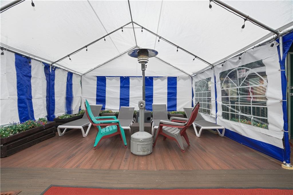 1075 Sheepshead Bay Road, Unit 2S Brooklyn, NY 11229 - Photo 24 of 30 a living room with furniture a window and wooden floor