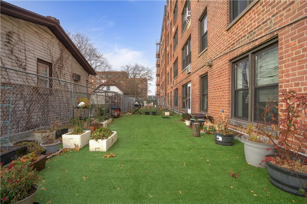 1075 Sheepshead Bay Road, Unit 2S Brooklyn, NY 11229 - Photo 26 of 30 a view of a chair and table in backyard of the house