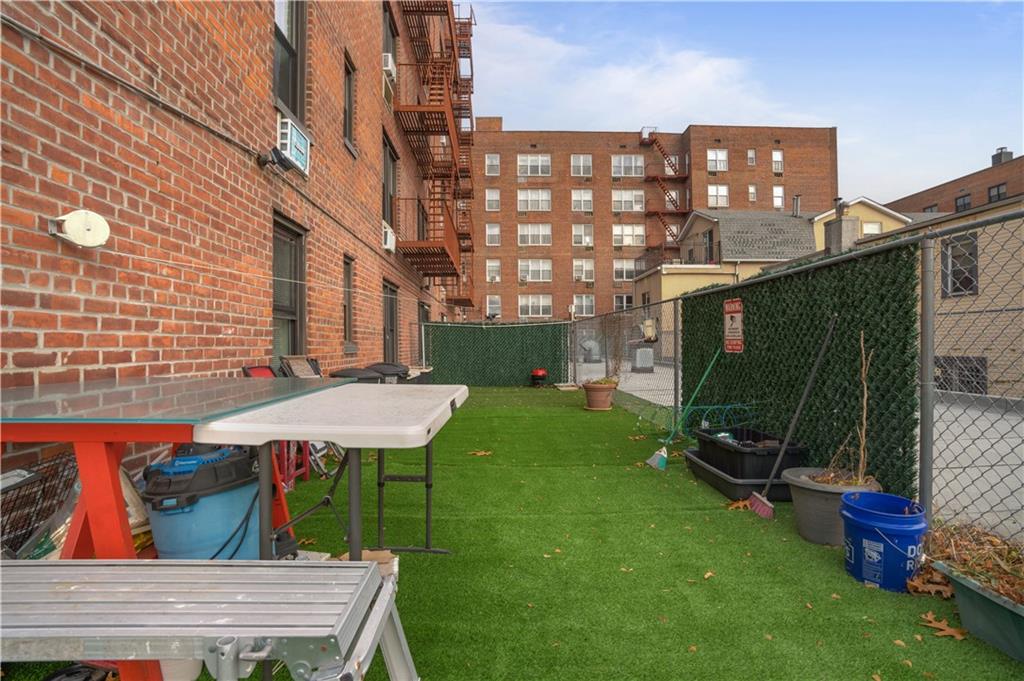 1075 Sheepshead Bay Road, Unit 2S Brooklyn, NY 11229 - Photo 28 of 30 a view of a patio with a table and chairs