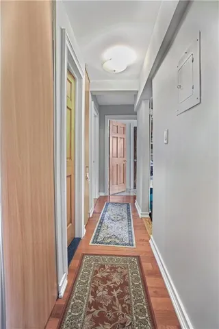 a view of bedroom with wooden floor