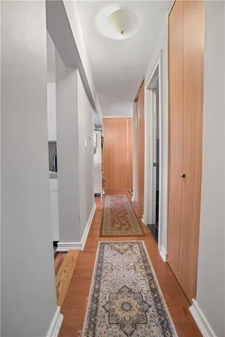 a view of a hallway with white walls