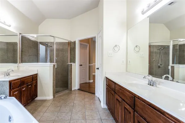 a spacious bathroom with a double vanity sink double vanity and a mirror