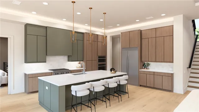 a kitchen that has a sink a table and chairs in it