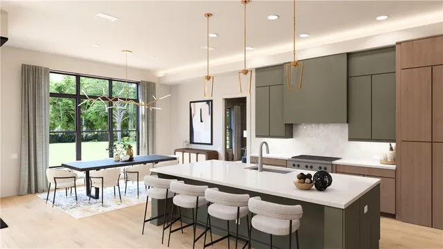 a kitchen with kitchen island stainless steel appliances a table chairs sink and large window