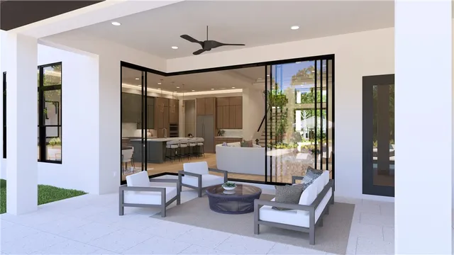 a living room with furniture and a floor to ceiling window