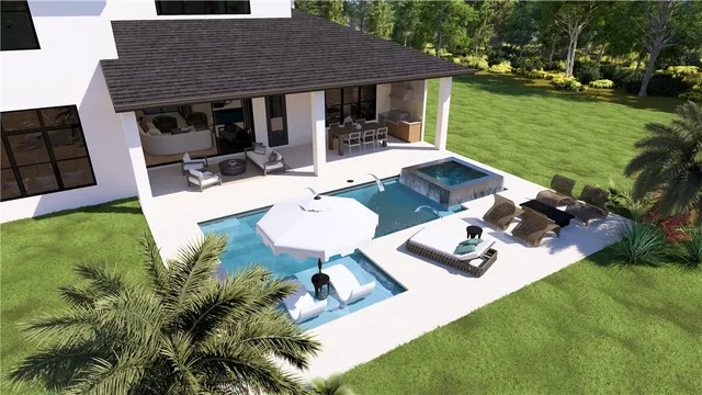 a view of a house with backyard and a garden