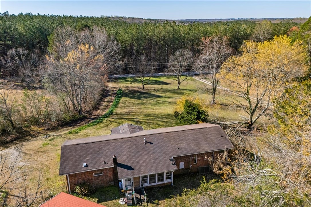 453 Deaton Road Walhalla, SC 29691 - Photo 12 of 28 An aerial view showcases a peaceful rural home surrounded by green trees and fields.