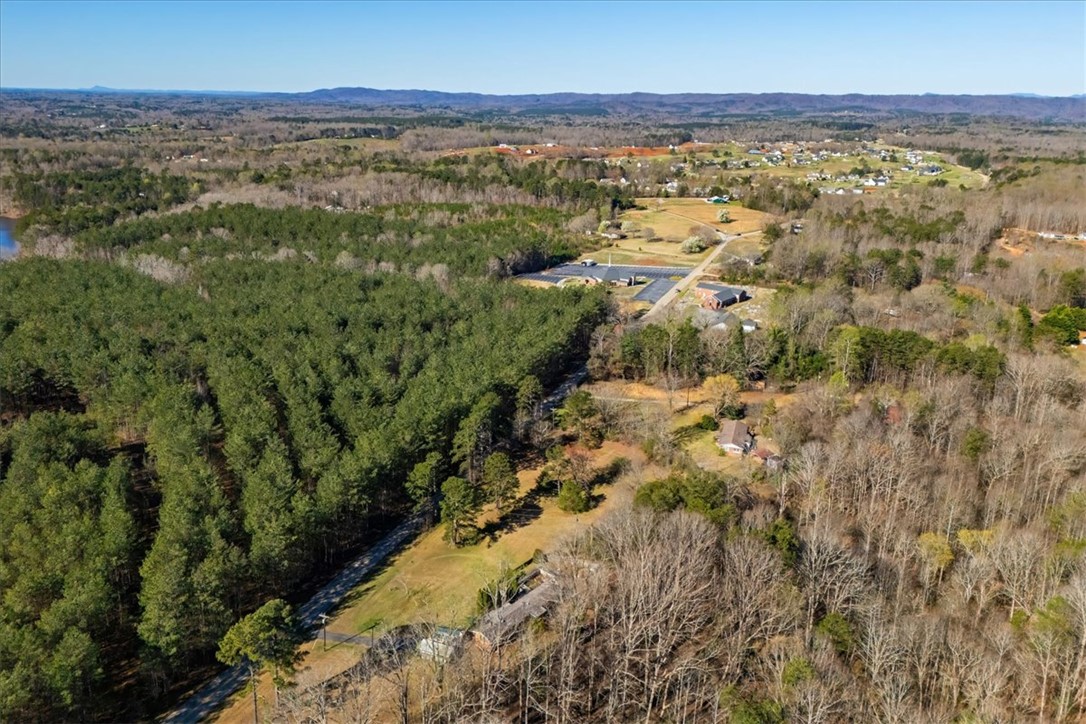 453 Deaton Road Walhalla, SC 29691 - Photo 20 of 28 Scenic aerial views reveal a vast landscape of wooded terrain and distant mountains.