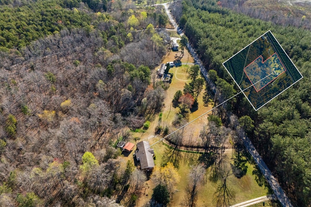 453 Deaton Road Walhalla, SC 29691 - Photo 28 of 28 An aerial view showcases a vast wooded estate with ample space and lush natural surroundings.