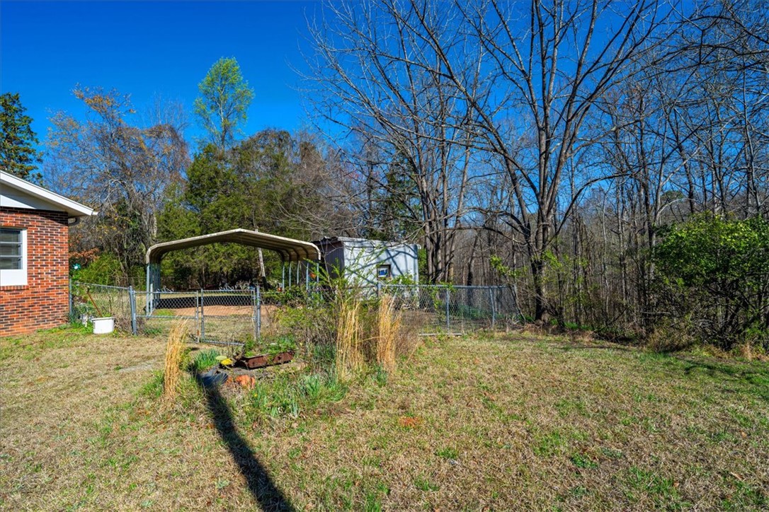 453 Deaton Road Walhalla, SC 29691 - Photo 3 of 28 This property features a spacious yard and convenient covered parking, ideal for outdoor living.