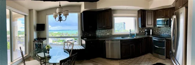 a view of living room and kitchen