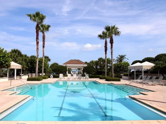 a view of a yard with chairs
