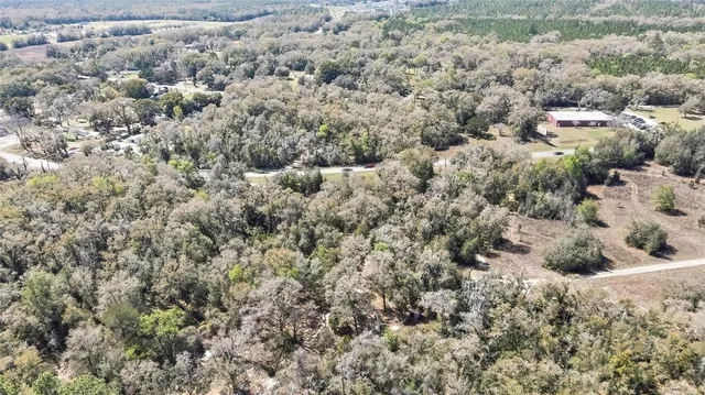 a view of a dry yard covered with snow