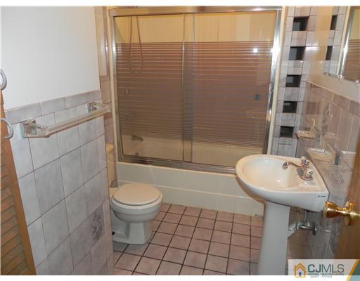 440 Old Post Road Edison, NJ 08817 - Photo 11 of 17 a bathroom with a sink toilet and shower