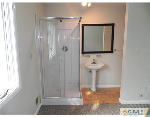 440 Old Post Road Edison, NJ 08817 - Photo 12 of 17 a bathroom with a sink and a mirror