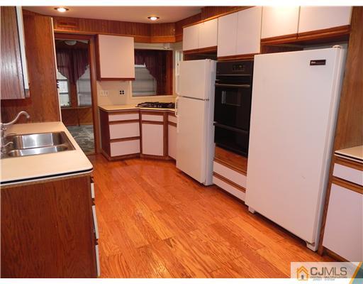 440 Old Post Road Edison, NJ 08817 - Photo 15 of 17 a kitchen with stainless steel appliances a refrigerator and a stove