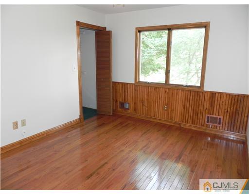440 Old Post Road Edison, NJ 08817 - Photo 8 of 17 an empty room with wooden floor and windows