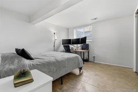 a bedroom with a bed and two night stand