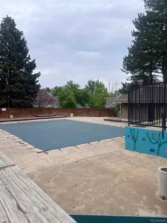 a view of swimming pool and tennis court