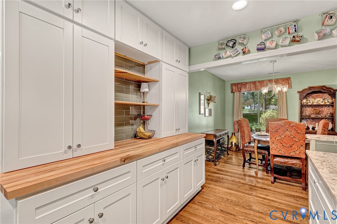 3841 Strawhill Road Richmond, VA 23231 - Photo 14 of 56 White cabinetry with brushed nickel hardware, natu