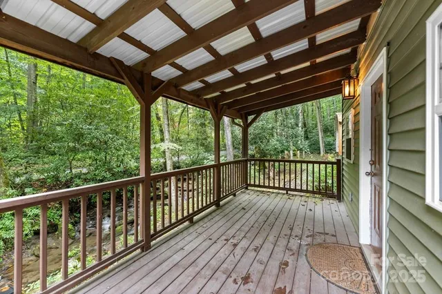 a view of balcony with wooden floor