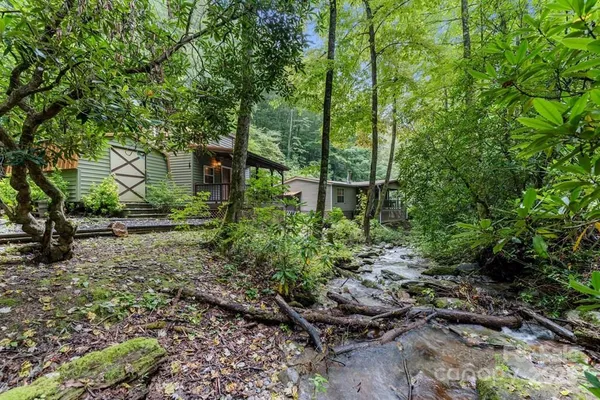 a backyard of a house with lots of green space