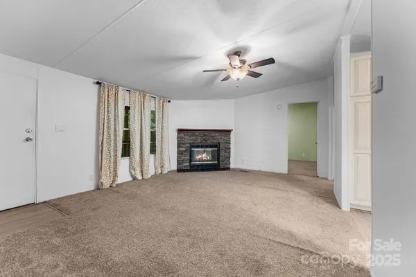 a big room with closet and a fireplace