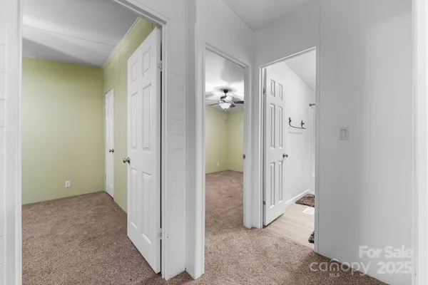 wooden floor with a bathroom view