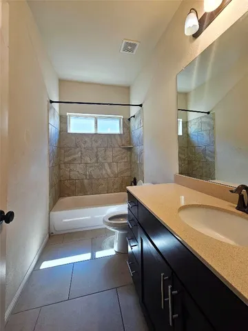 a view of swimming pool with wooden fence