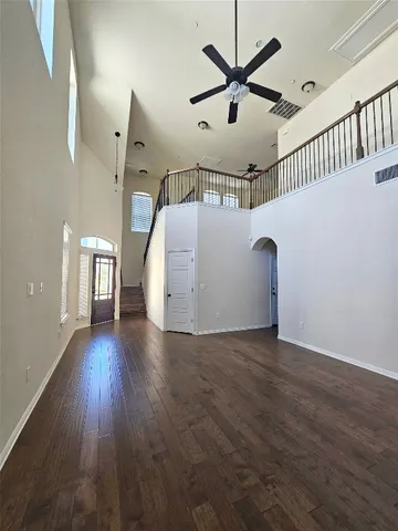 a kitchen with sink a microwave a stove and cabinets