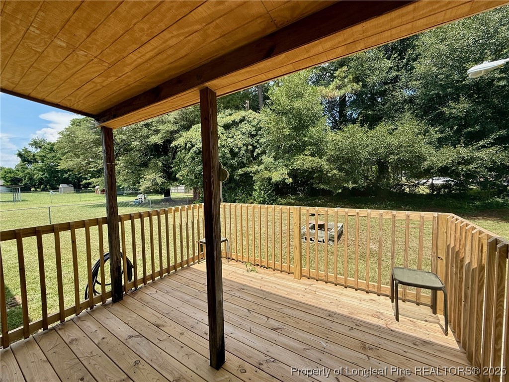 135 Snowhill Church Road Fayetteville, NC 28306 - Photo 11 of 13 a view of balcony with wooden floor