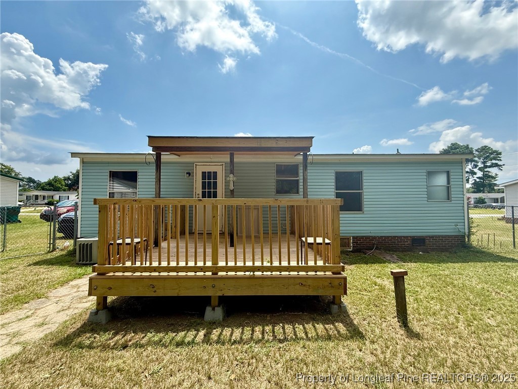 135 Snowhill Church Road Fayetteville, NC 28306 - Photo 12 of 13 a view of a house with a bed and wooden floor