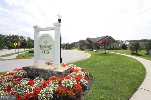 a view of an house with backyard space and garden