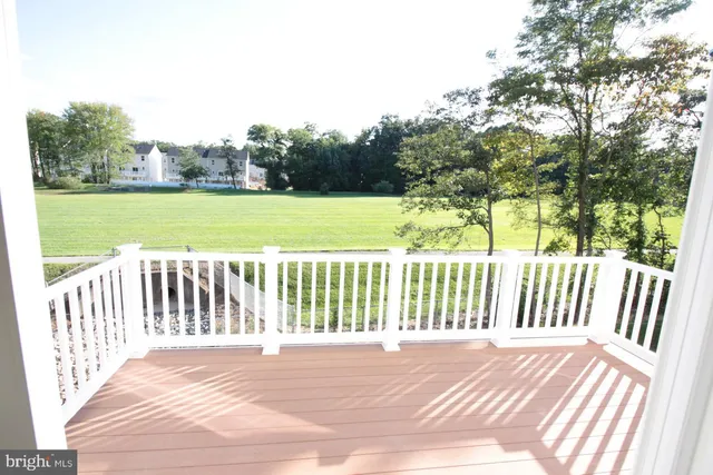 a view of a deck with a yard