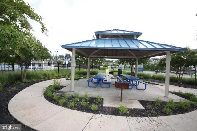 a view of a backyard with sitting area and furniture