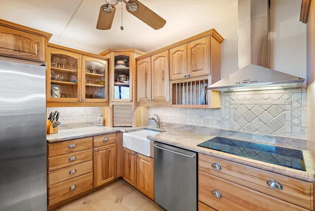 a kitchen with a sink cabinets and dining table