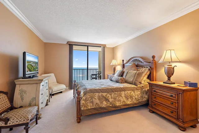 a bedroom with two beds and a dresser with wooden floor