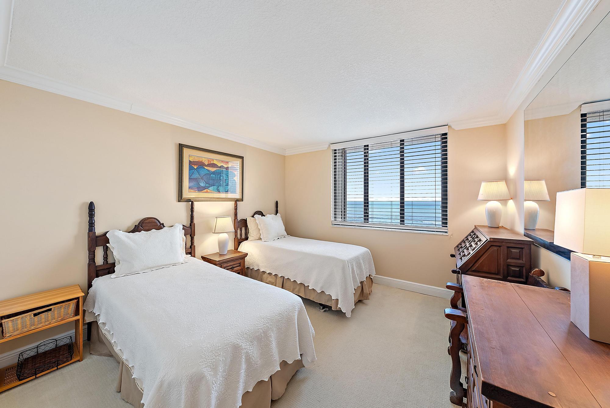 400 Ocean Trail Way, Unit 1409 Jupiter, FL 33477 - Photo 25 of 30 a bedroom with two beds and a dresser with wooden floor