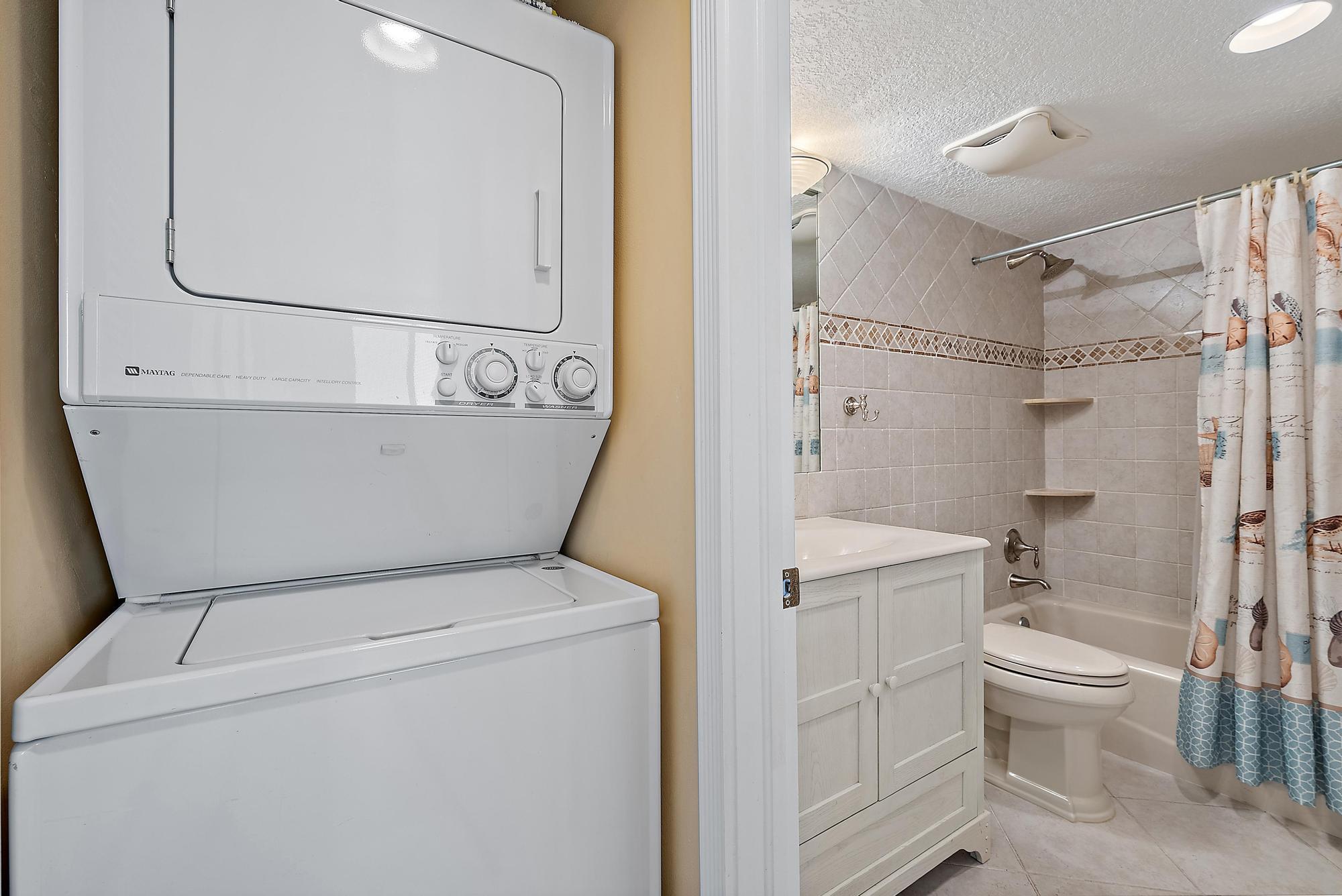 400 Ocean Trail Way, Unit 1409 Jupiter, FL 33477 - Photo 26 of 30 a bathroom with a sink a toilet and shower