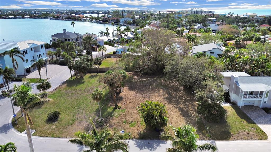 116 6th Street Belleair Beach, FL 33786 - Photo 2 of 9 an aerial view of a house with a lake view