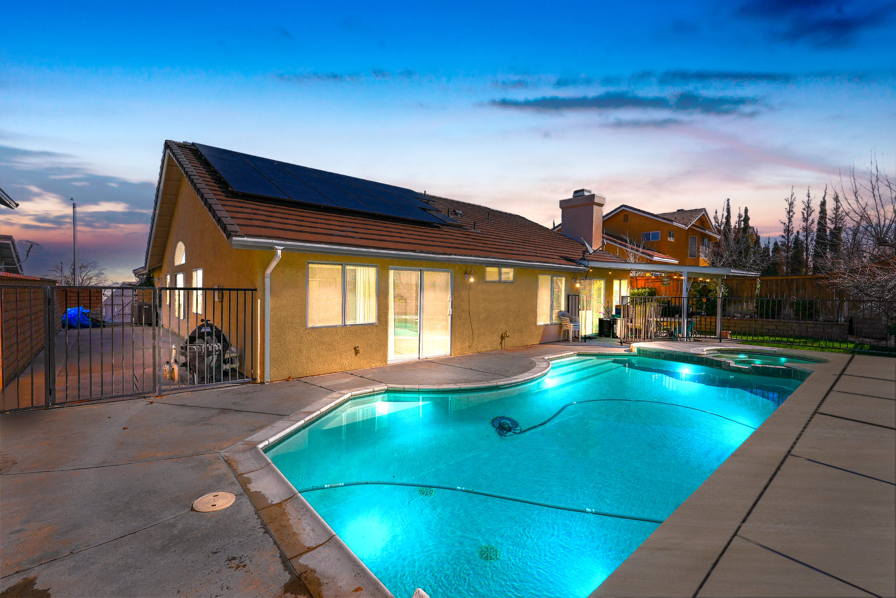 3030 Quarry Road Palmdale, CA 93550 - Photo 1 of 46 a view of swimming pool with seating area and roof