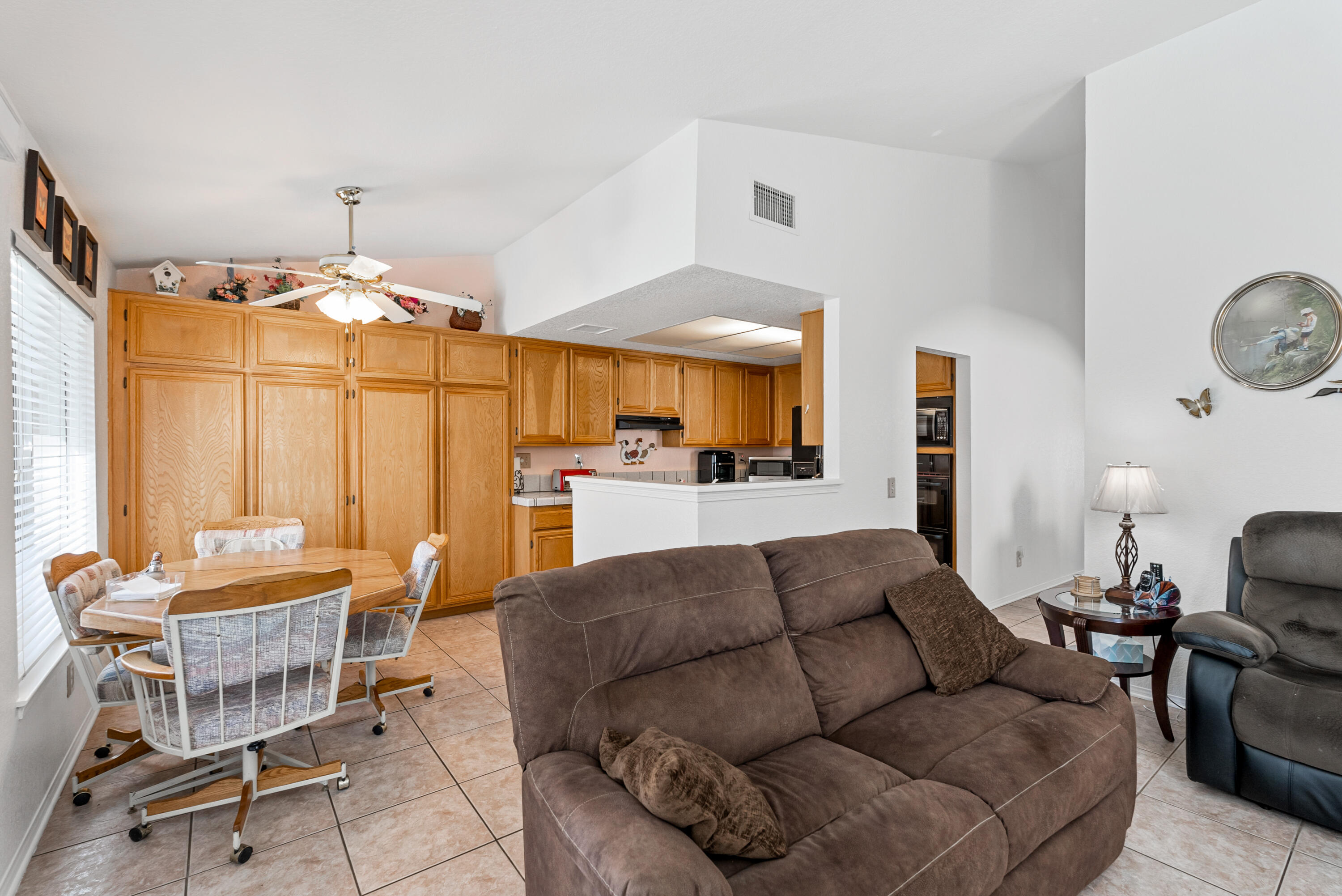 3030 Quarry Road Palmdale, CA 93550 - Photo 13 of 46 a living room with furniture a table and chairs
