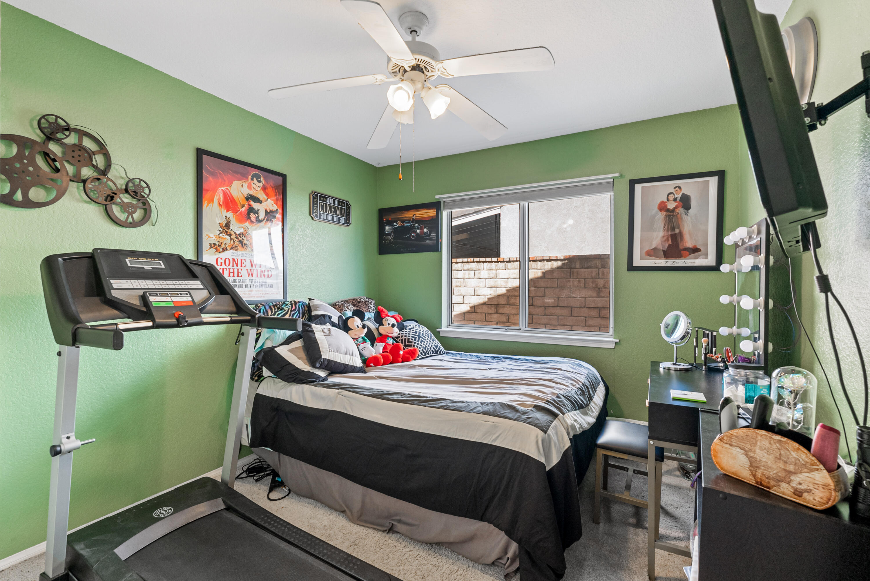 3030 Quarry Road Palmdale, CA 93550 - Photo 28 of 46 a bedroom with a bed and a flat screen tv