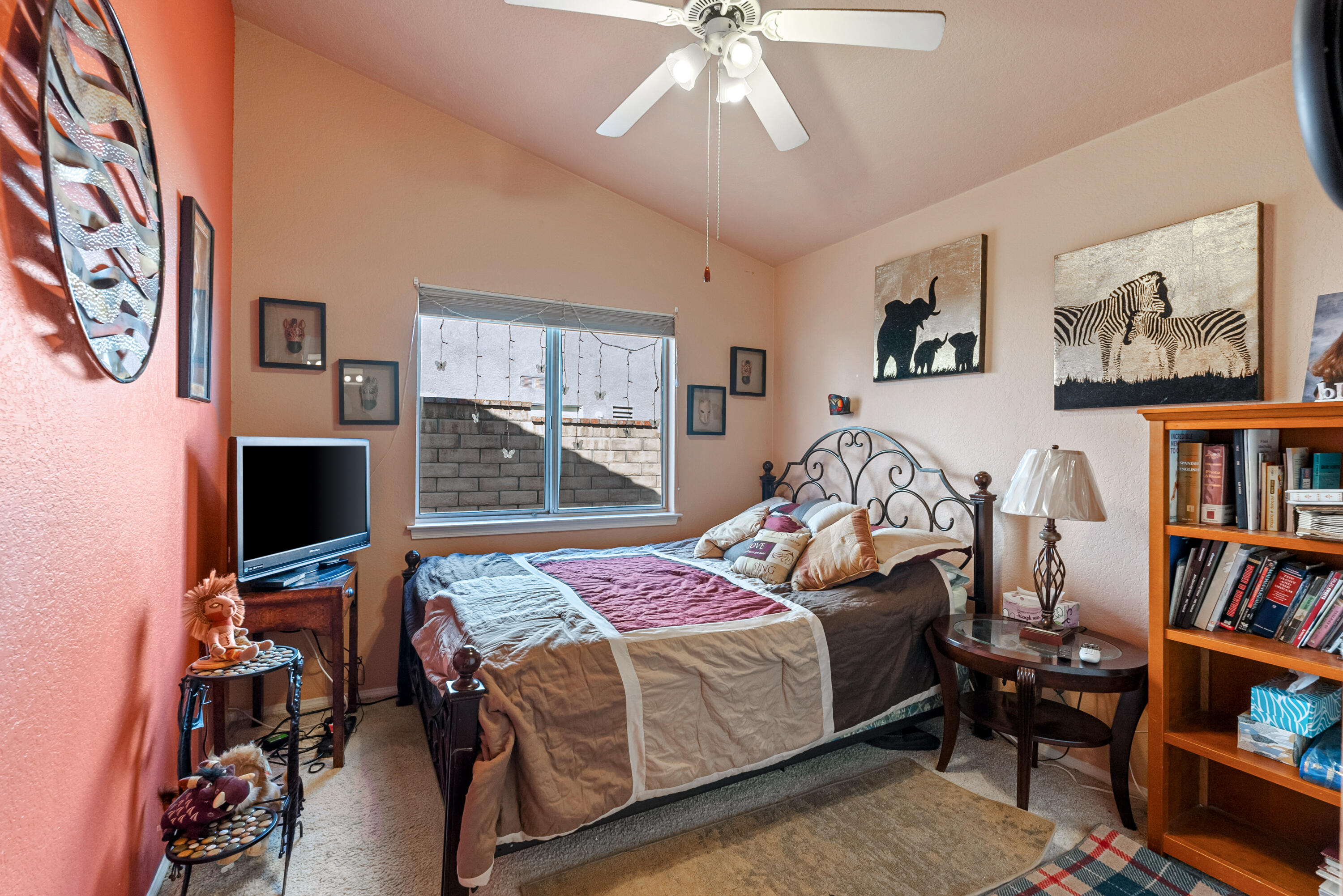 3030 Quarry Road Palmdale, CA 93550 - Photo 30 of 46 a bedroom with a bed and a book shelf