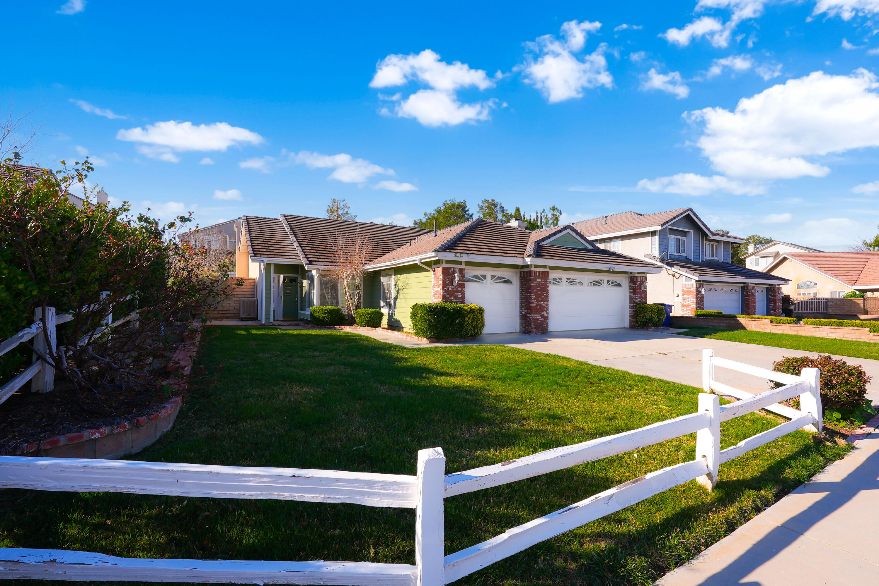 3030 Quarry Road Palmdale, CA 93550 - Photo 3 of 46 a front view of a house with garden